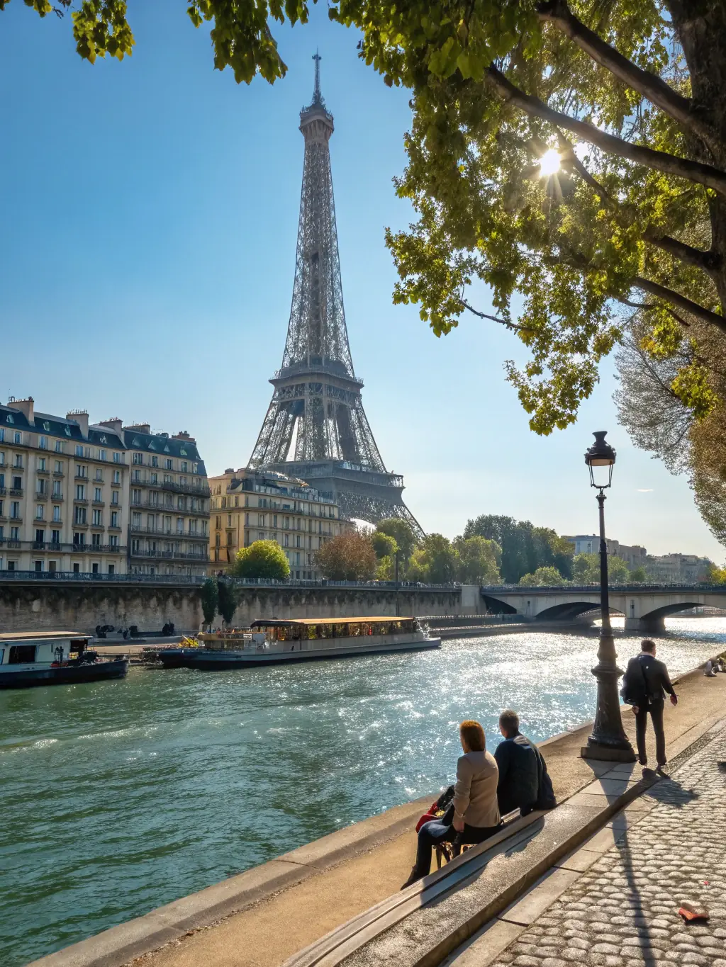 A photograph of the Eiffel Tower with the Seine River in the foreground, capturing a classic Parisian scene.